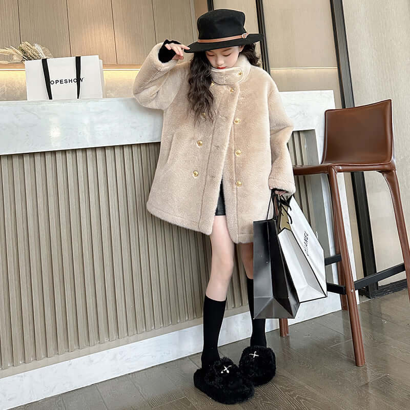 Children's luxury light fur coat in apricot, mid-length, stylish design for girls, perfect for fashion-forward young ladies.