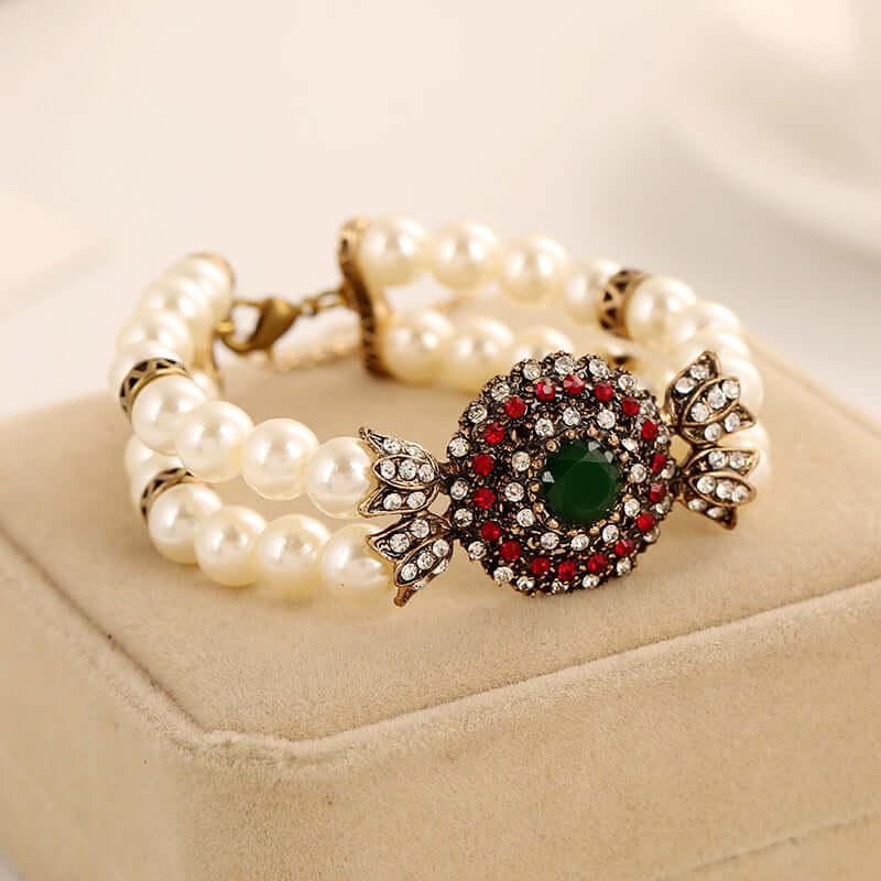 Luxury pearl bracelet with an intricate gemstone centerpiece, crafted from high-quality alloy.